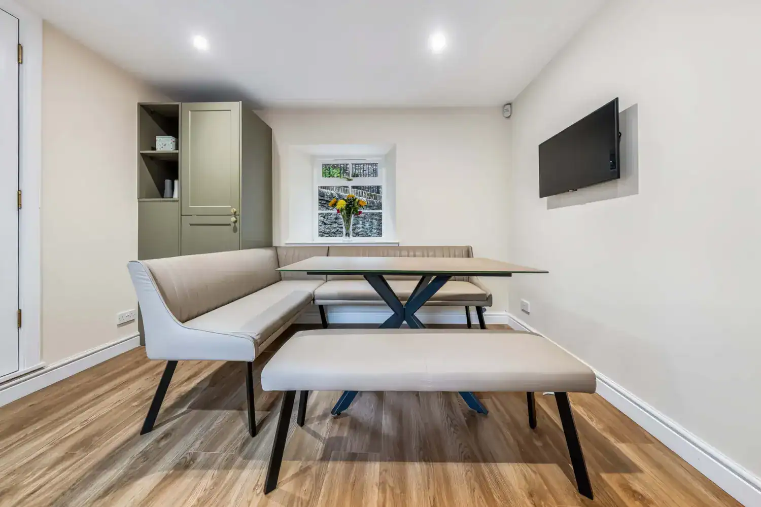 Dining table with upholstered bench seating