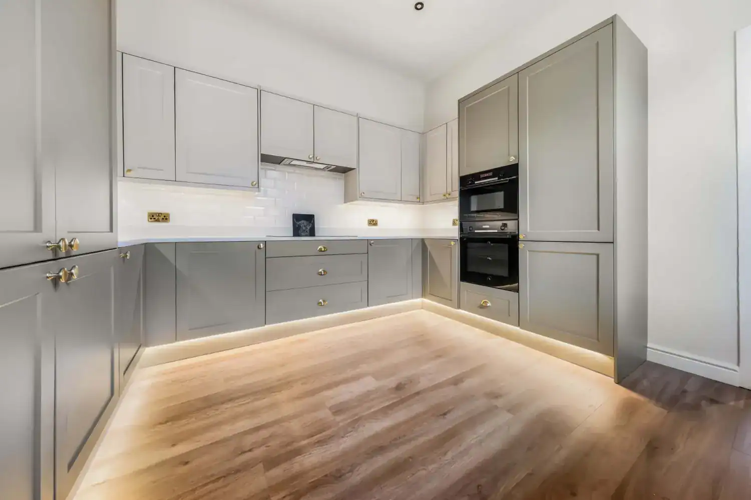 Grey kitchen with under-cabinet lighting