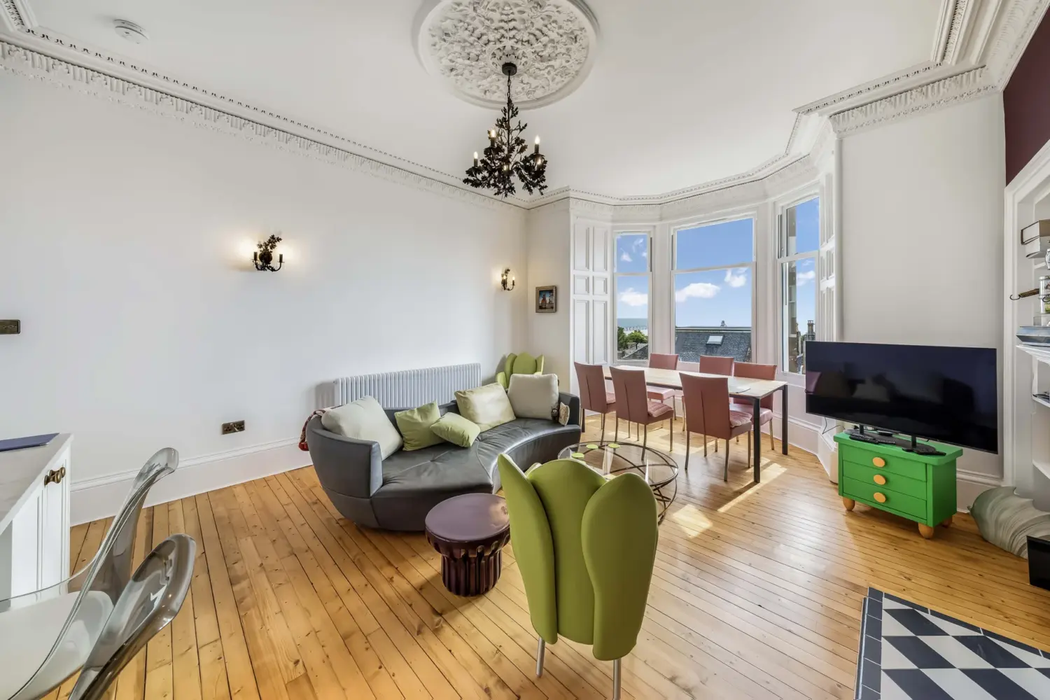 Living and dining room with a bay window